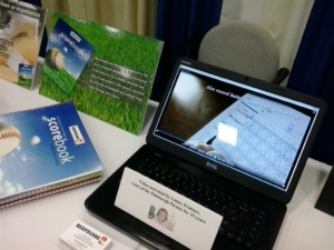 Center section of the KeepScore trade show booth. The laptop presented a continuous loop of the "how-to" video found on the KeepScore Web site. The video was narrated by Lanny Frattare, voice of the Pittsburgh Pirates for 33 years.