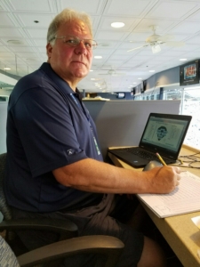 KeepScore co-founder Thomas "TJ" Lane scores a Pirate game in the booth at PNC Park for Major League Baseball during the 2016 season. His scoring system of choice: why, the KeepScore Baseball/Softball Scorebook, of course.
